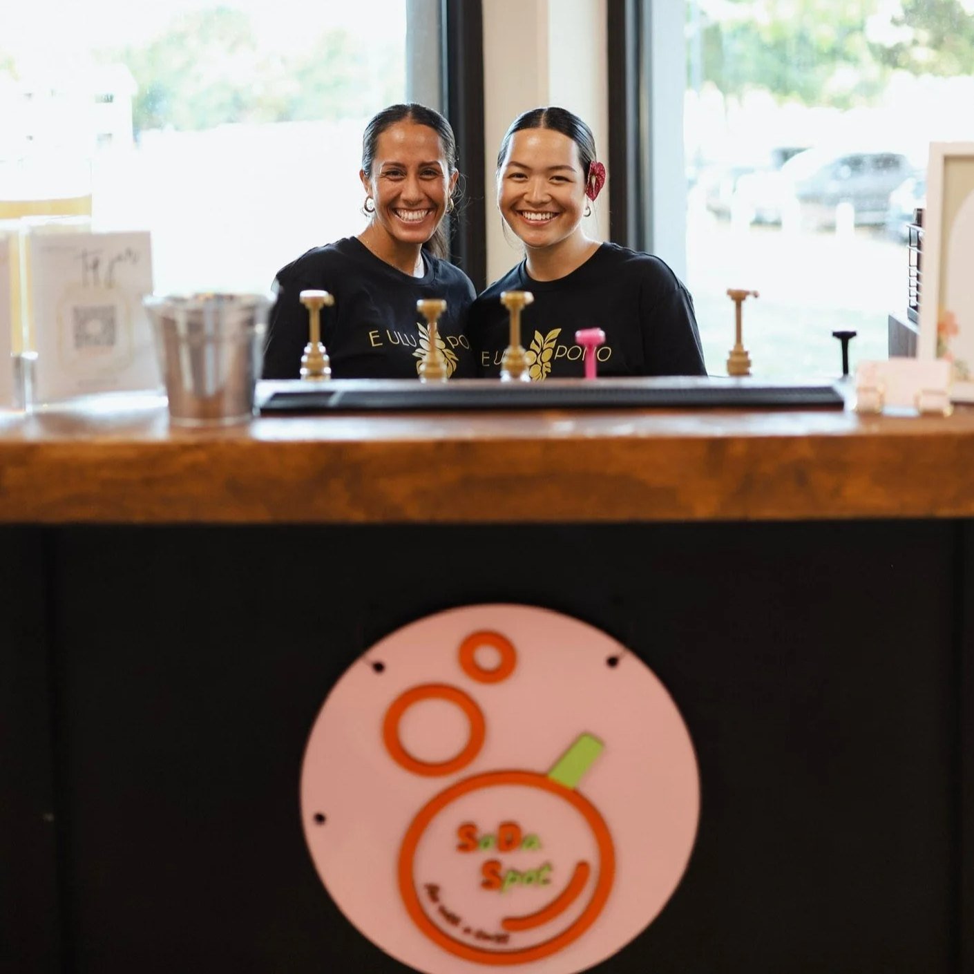 The SoDaSpot team serving from their mobile soda bar